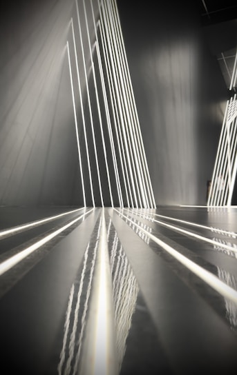 Abstract architectural lines converging to symbolize structured transformation and disciplined execution.