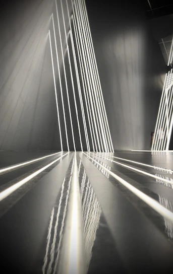 Abstract architectural lines converging to symbolize structured transformation and disciplined execution.