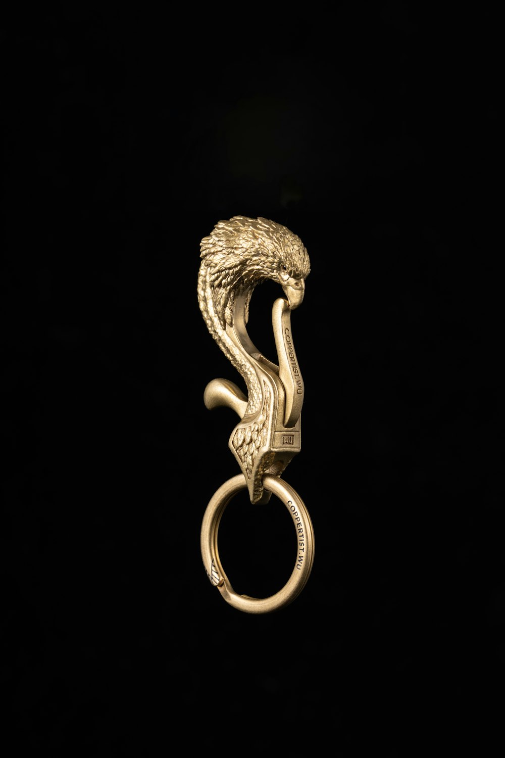 a gold ring with a snake on it