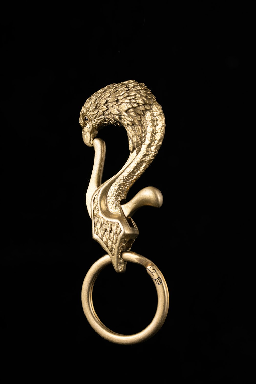 a gold ring with a snake on it