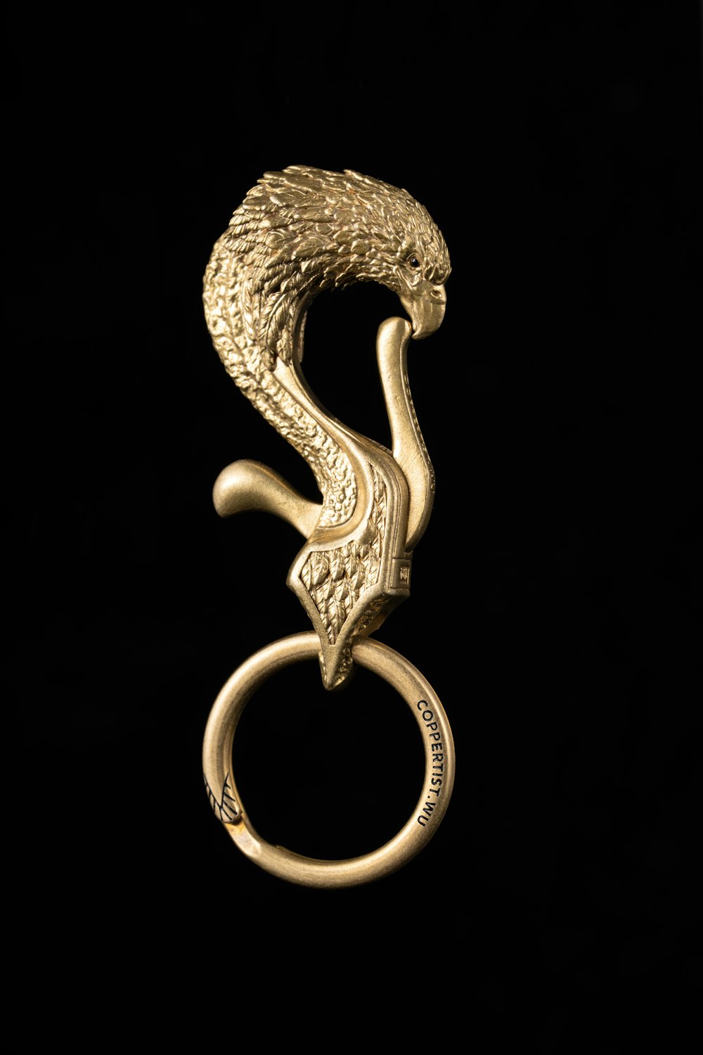 a gold ring with a snake on it