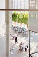 A bright common area with seating arranged for conversation and support group meetings.