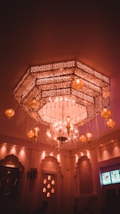 Close-up of elegant wall décor and lighting fixtures enhancing a cozy room.