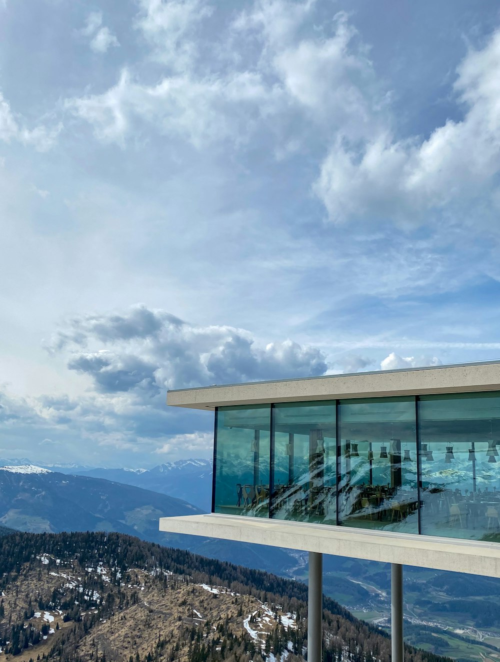 a view of the mountains from the top of a building