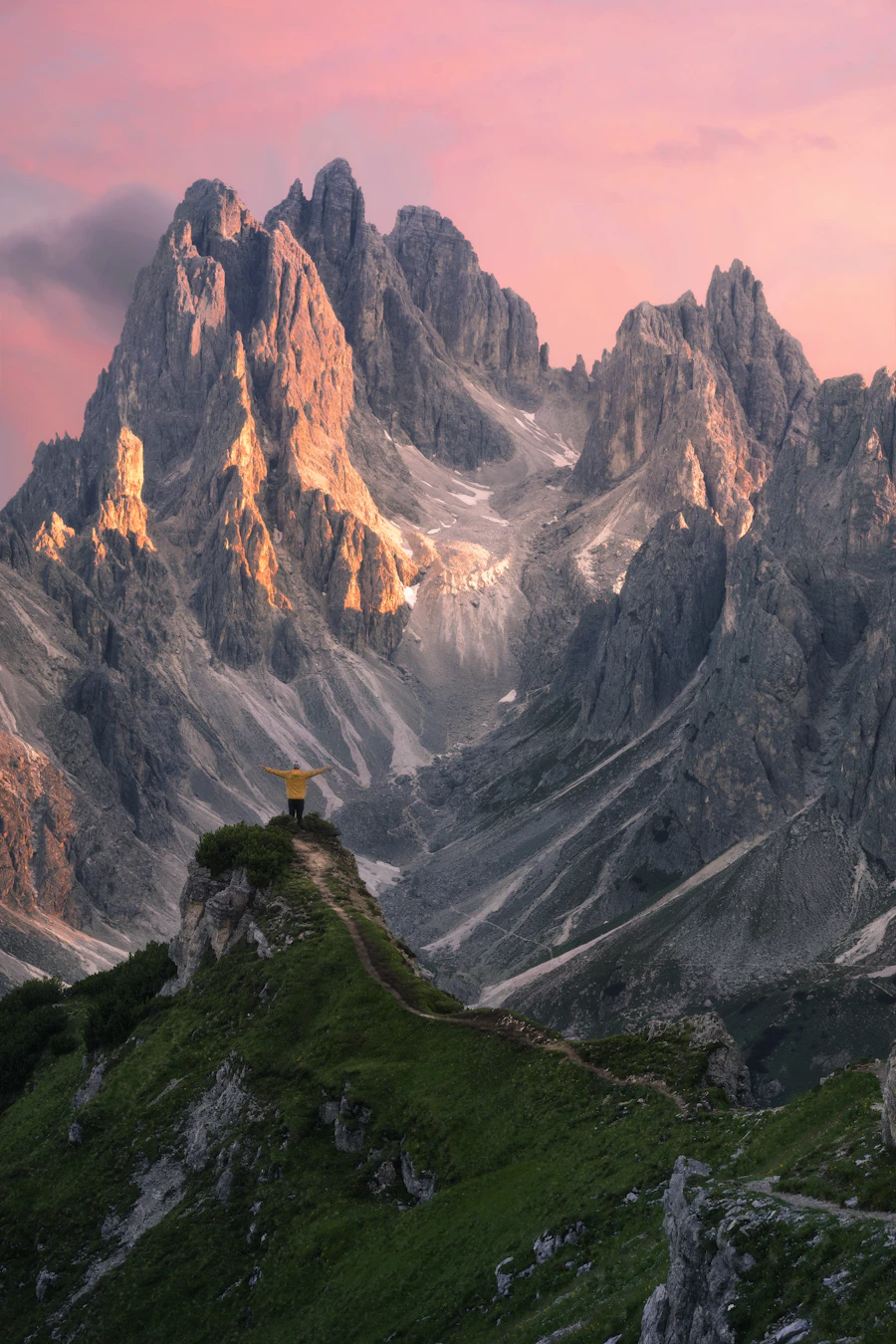 A mountain hut perched on a rocky ridge in the Dolomites
