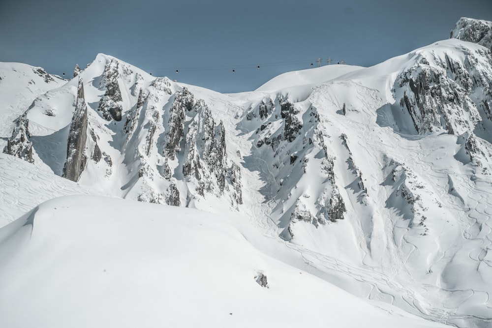 a person skiing down a snow covered mountain