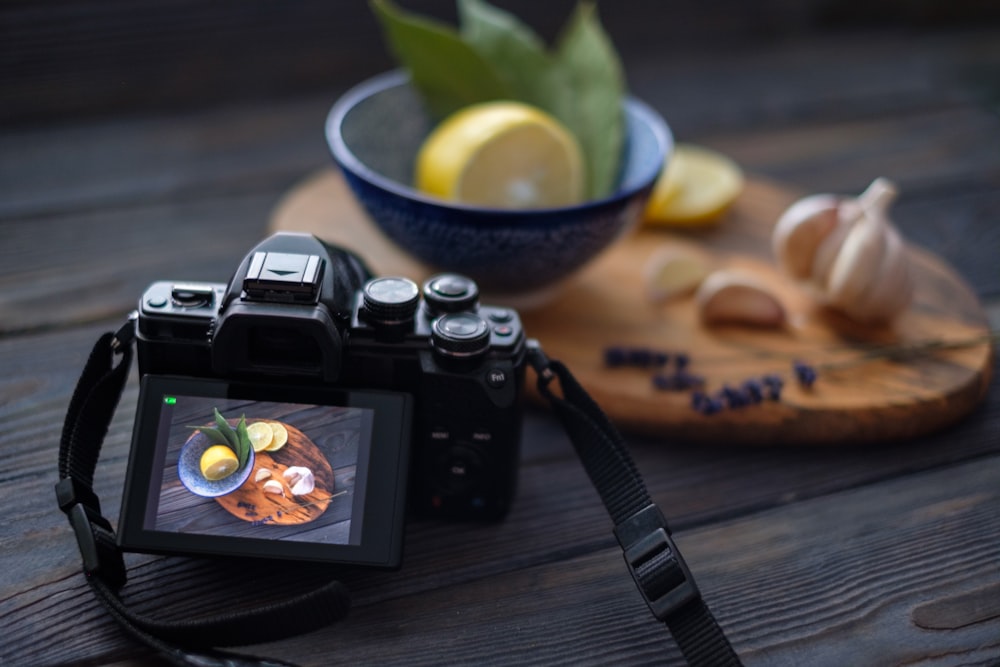 a camera sitting on top of a wooden table