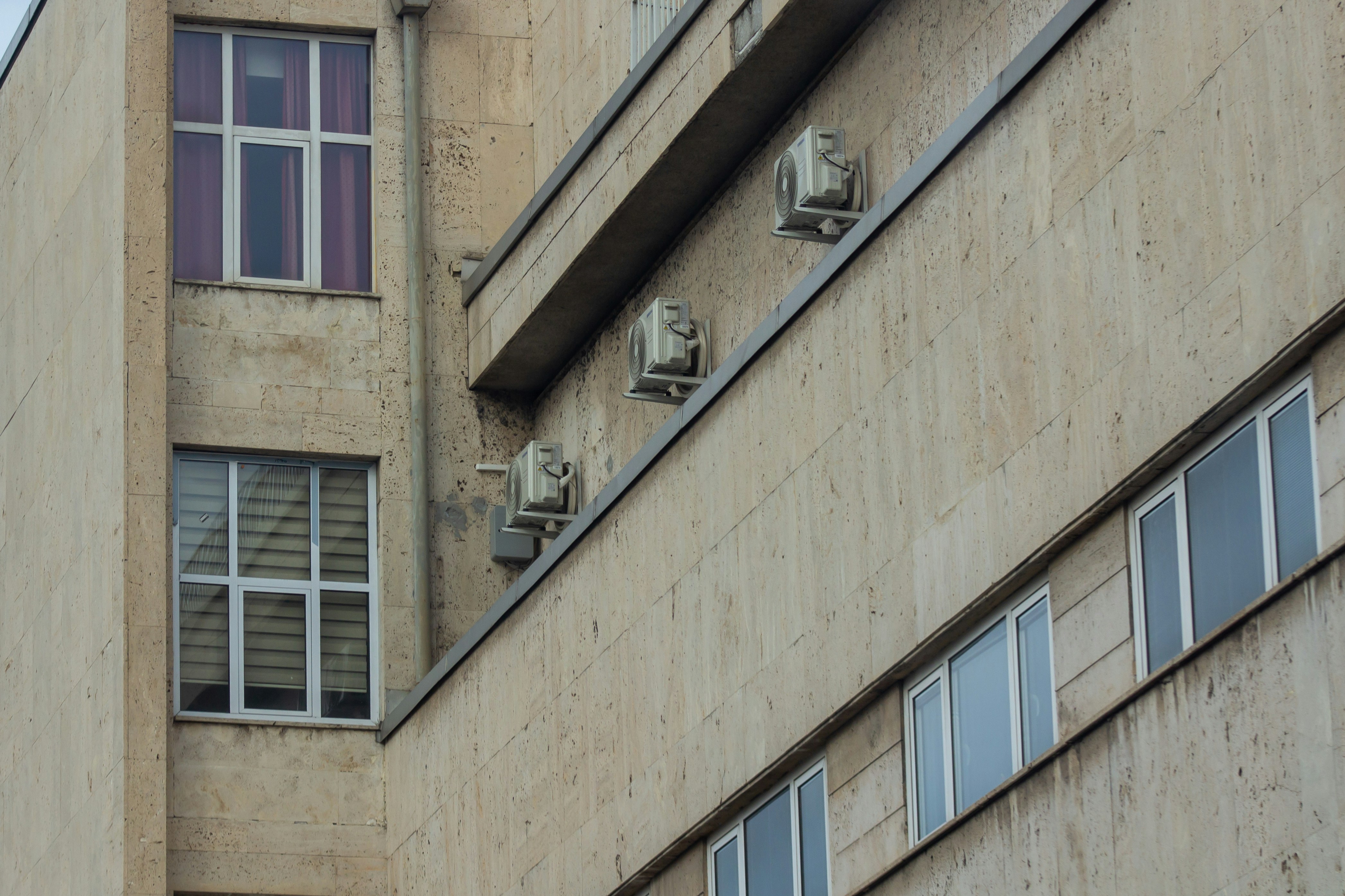 a tall building with a clock on the side of it