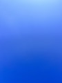 an airplane flying in the sky with a blue background