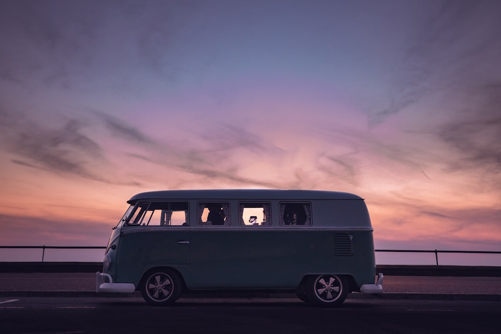 a vw bus parked on the side of the road