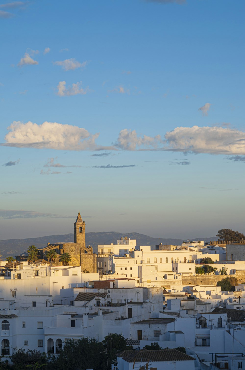 a view of a city with a clock tower