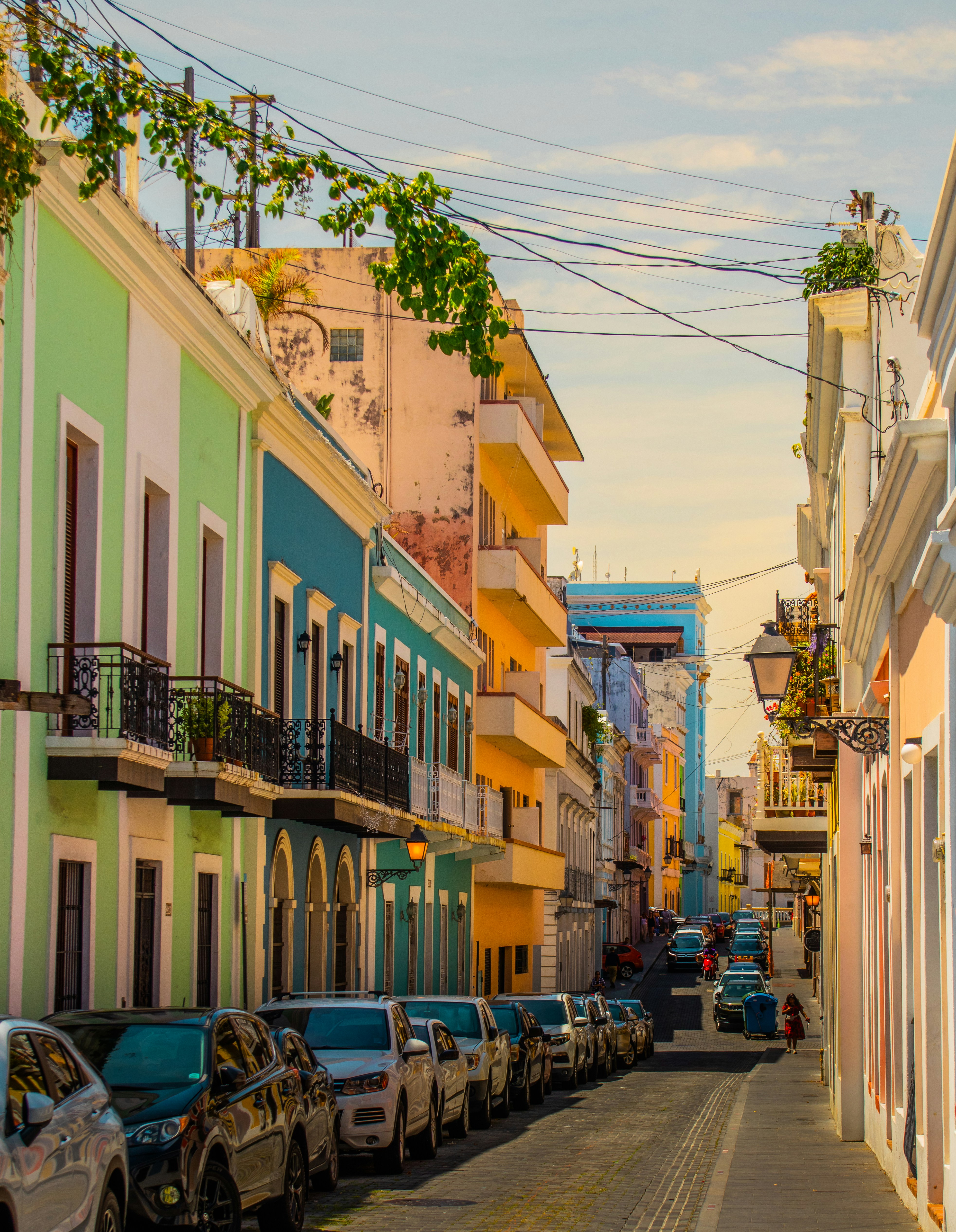a row of parked cars on a city street