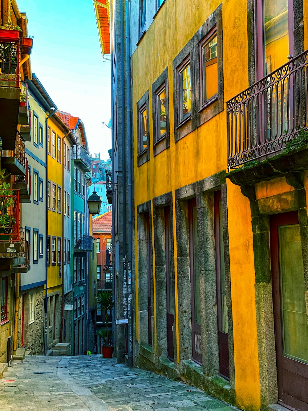 a narrow city street lined with tall buildings