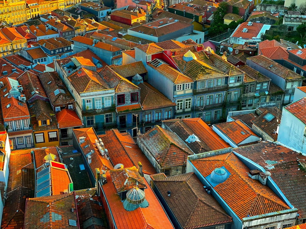 an aerial view of a city with red roofs