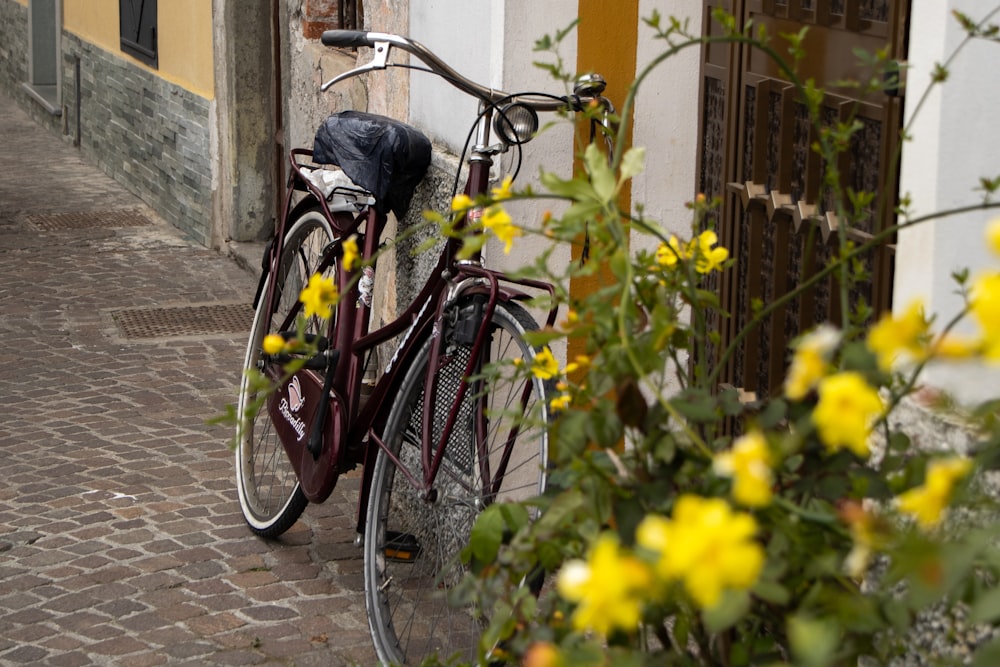 a bicycle parked on the side of a building