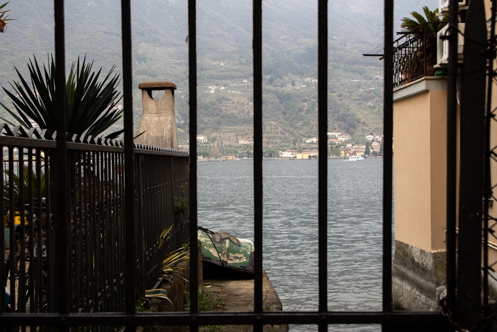 a view of a body of water through a gate