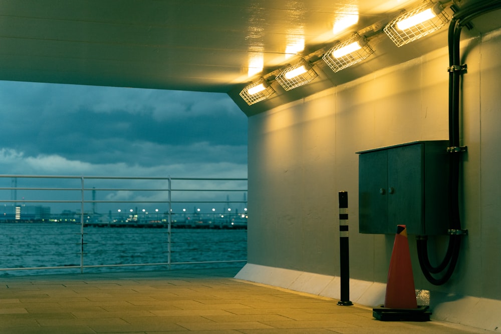 a public restroom with a view of a body of water