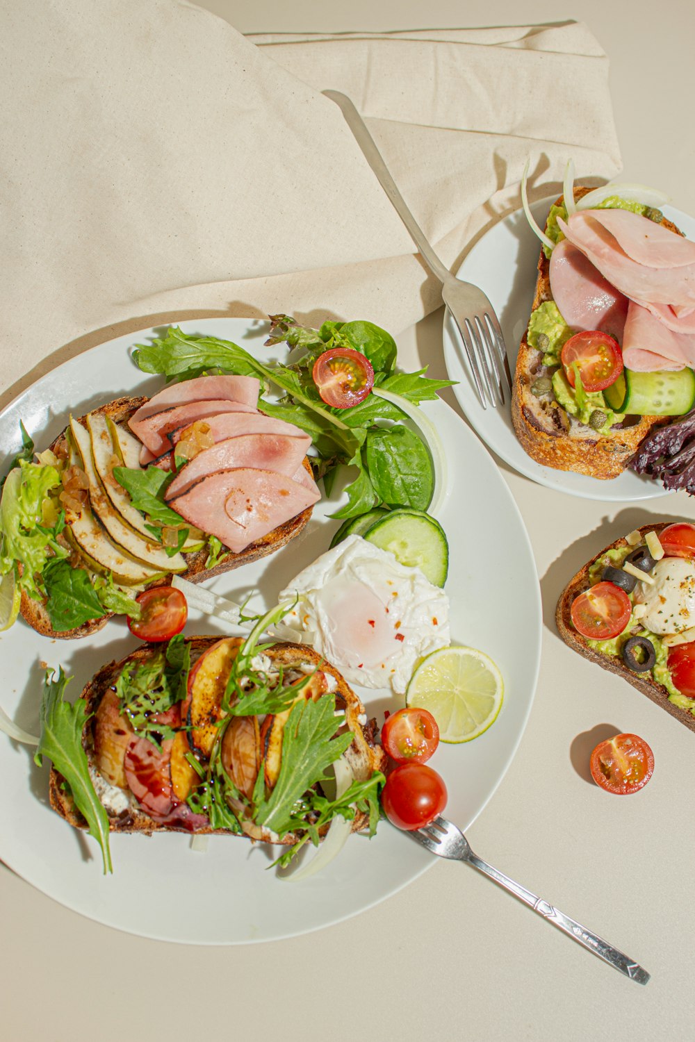 a white plate topped with a sandwich and salad