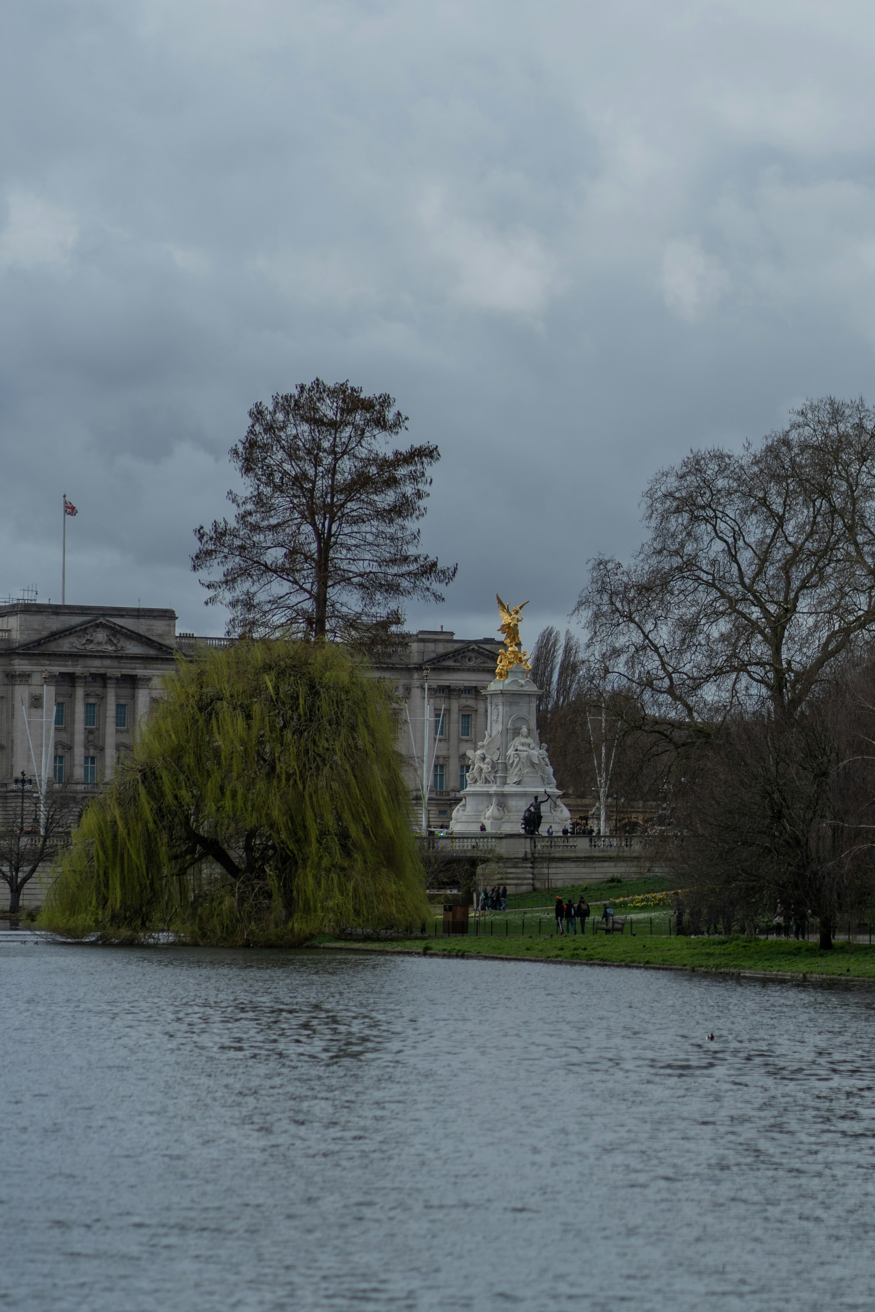 a body of water in front of a large building