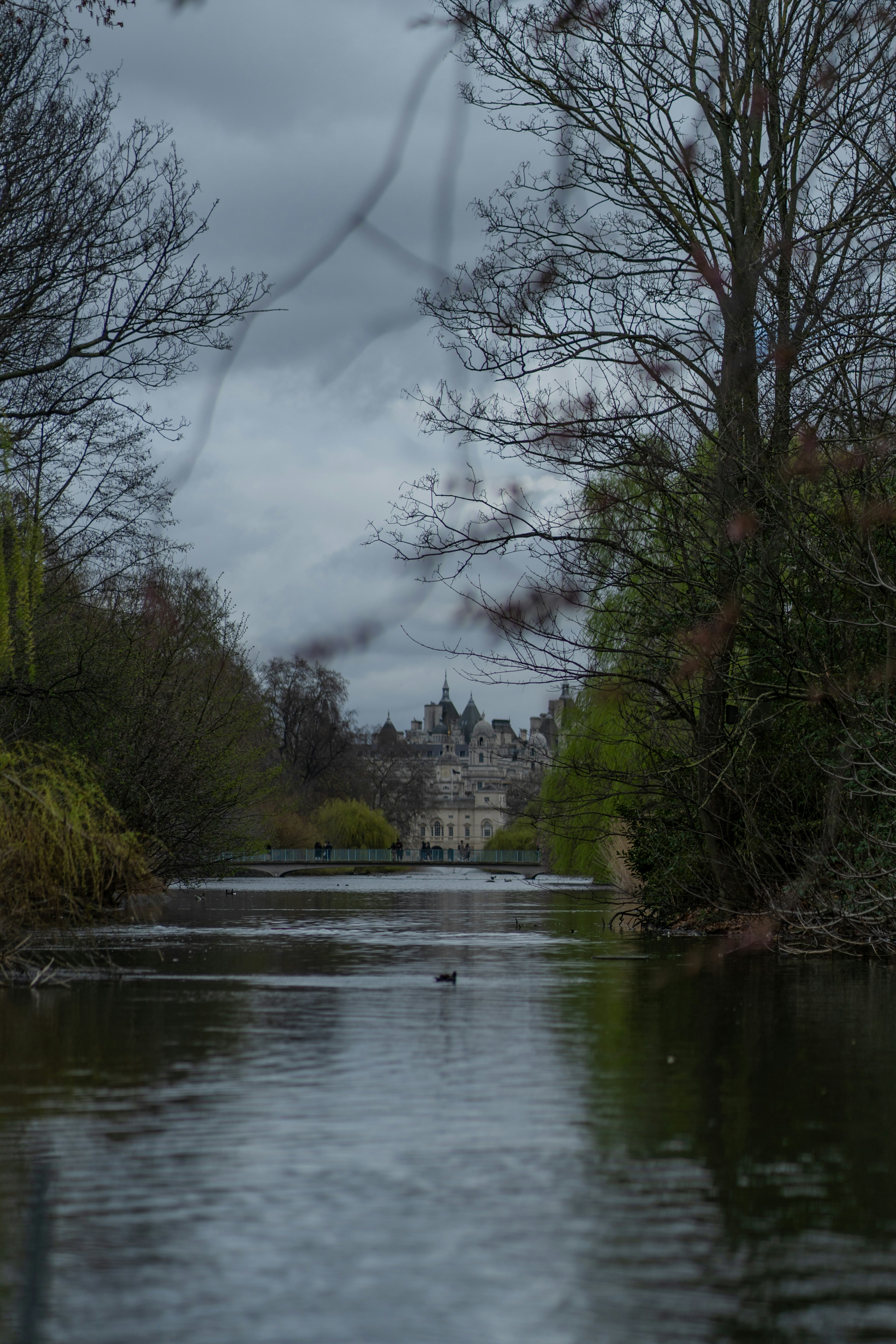 a view of a river with a castle in the background