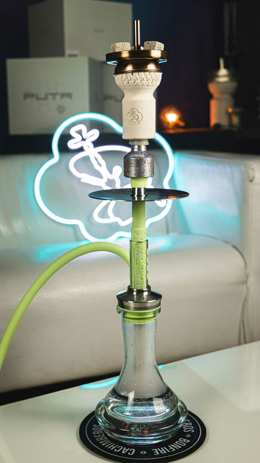 a hookah with a lite up hookah stick on top of it