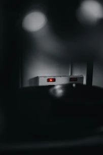 Encrypted communication devices glowing with secure data transmissions in a dark setting.