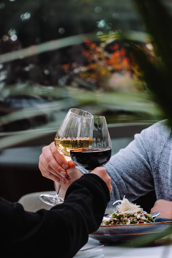 Couple sitting at a table with wine glasses on a date night