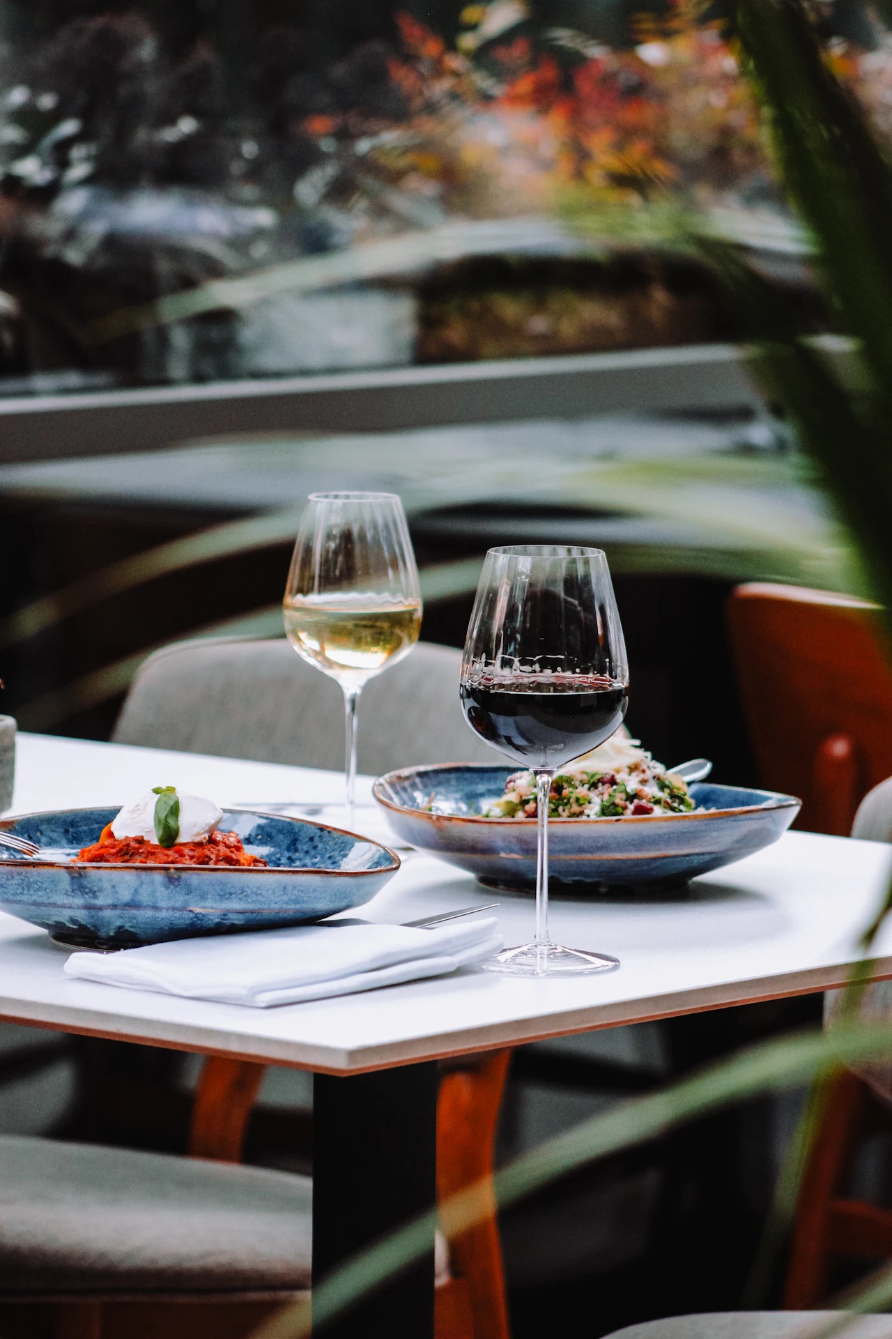 A table of shared plates and wine