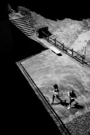 a couple of people that are standing in the dirt