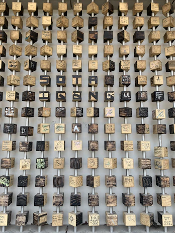 A playful wall installation made from mismatched frames and odd trinkets.