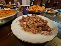 a plate full of food sitting on a table
