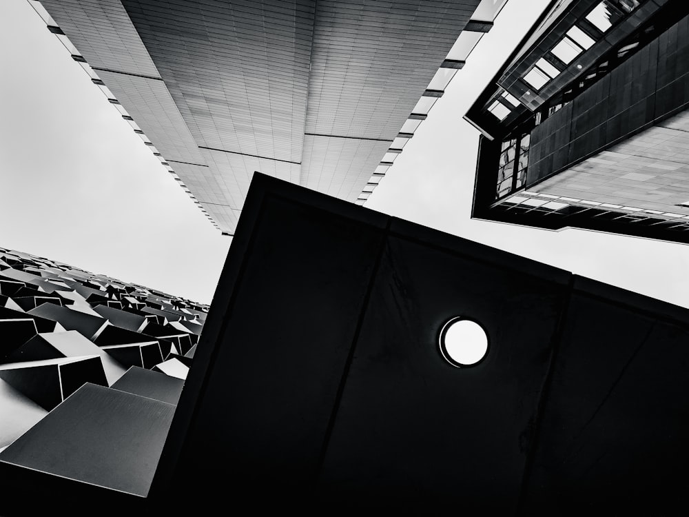 a black and white photo of a building with a circular window