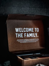 A customer happily receiving their motorcycle accessories package at home.