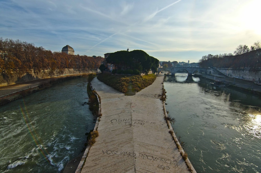 a walkway that is next to a river