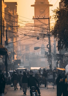 a group of people walking down a street