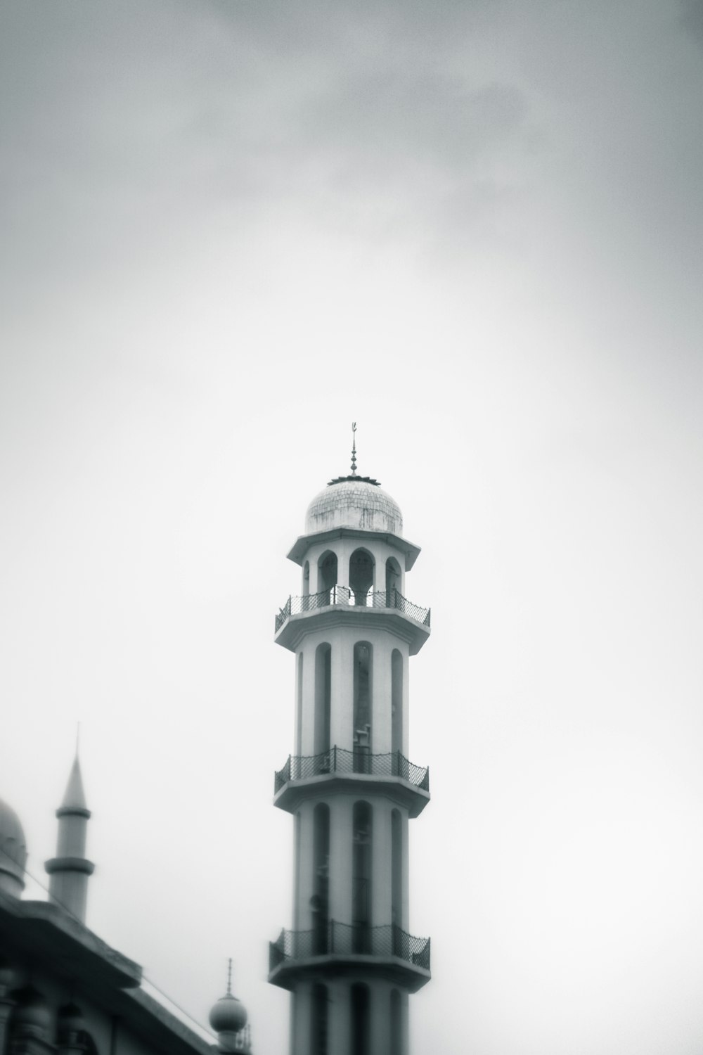 a black and white photo of a clock tower