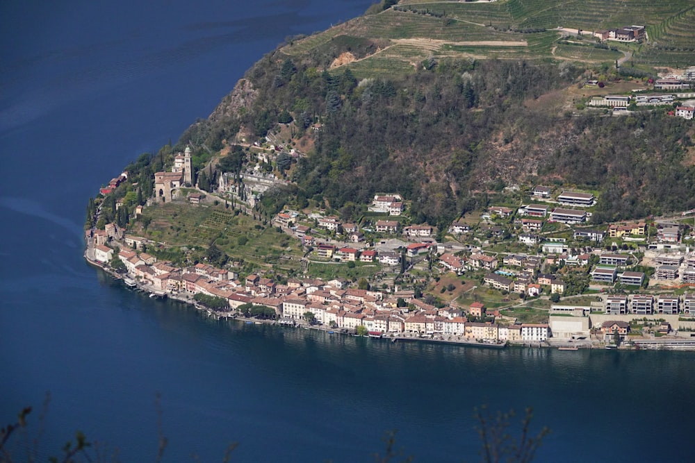 an aerial view of a town on a mountain side