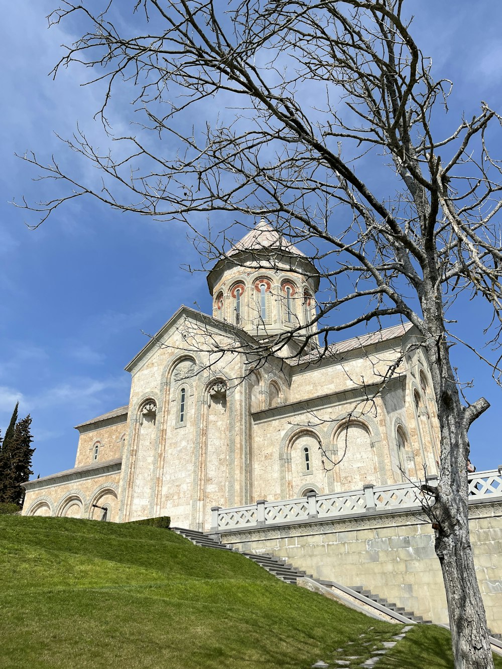 a large building with a tree in front of it