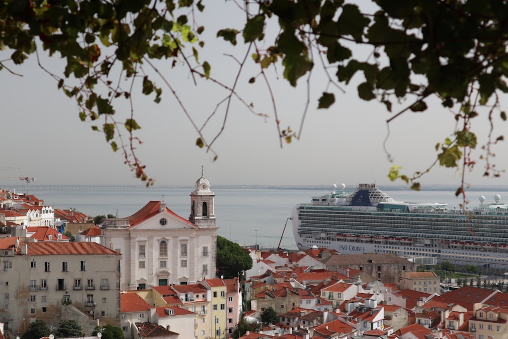 a cruise ship is in the background of a city