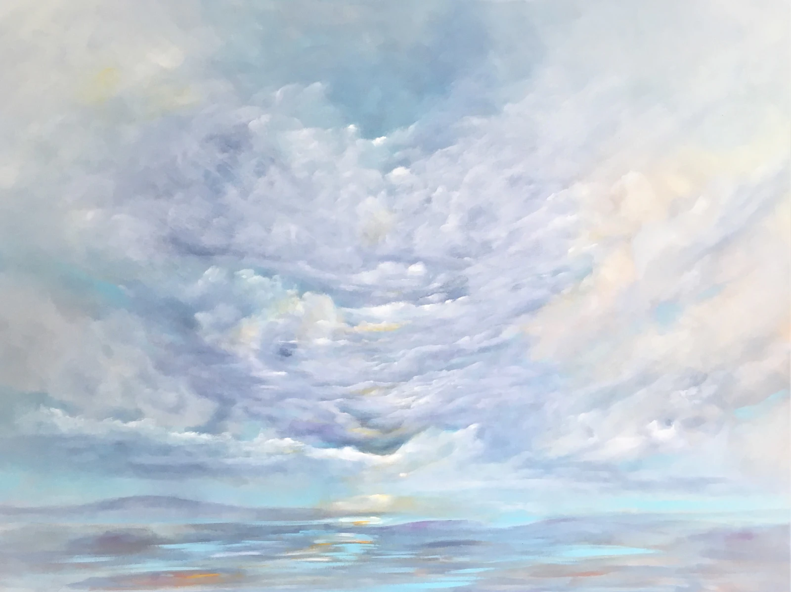 Soft, luminous clouds drifting over a pale horizon.