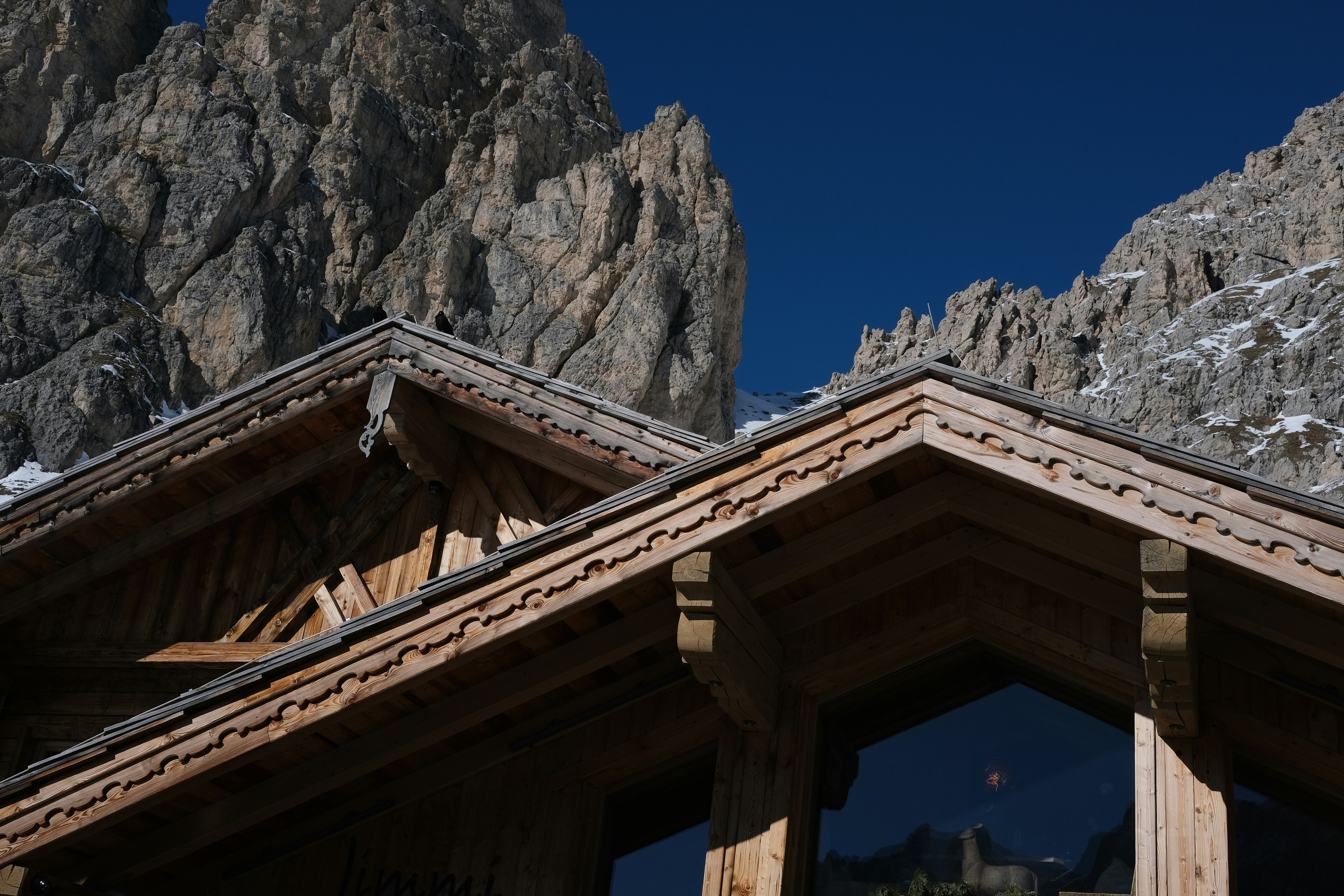 a building with a mountain in the background