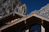 Close-up of natural wood textures and stone details on a chalet exterior.