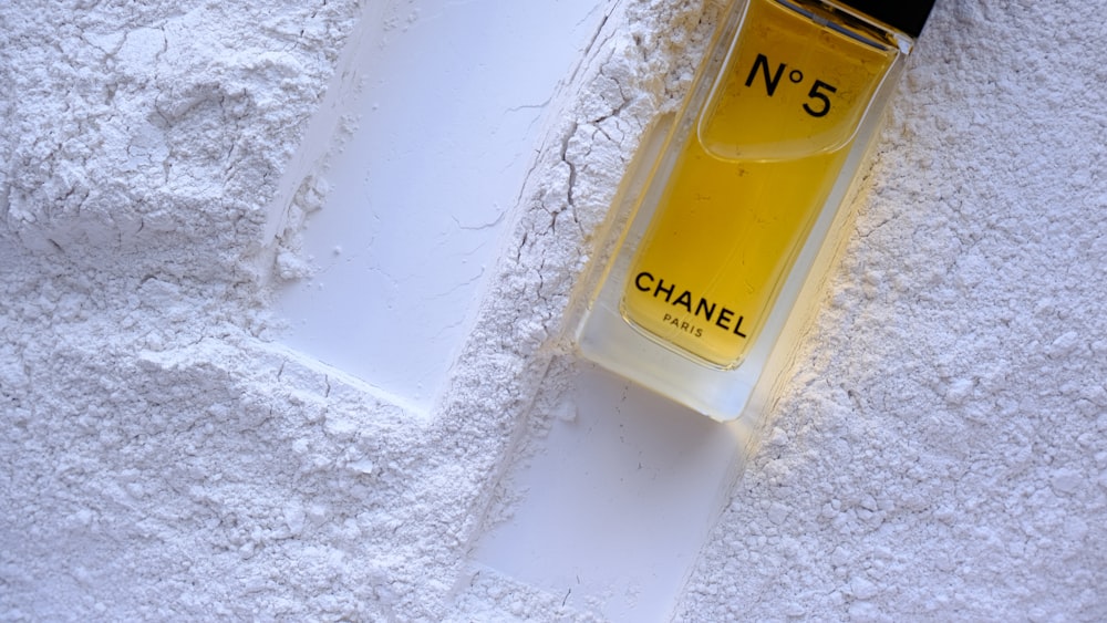 A bottle of chanel no 5 on a white surface photo – Free Texture Image on  Unsplash