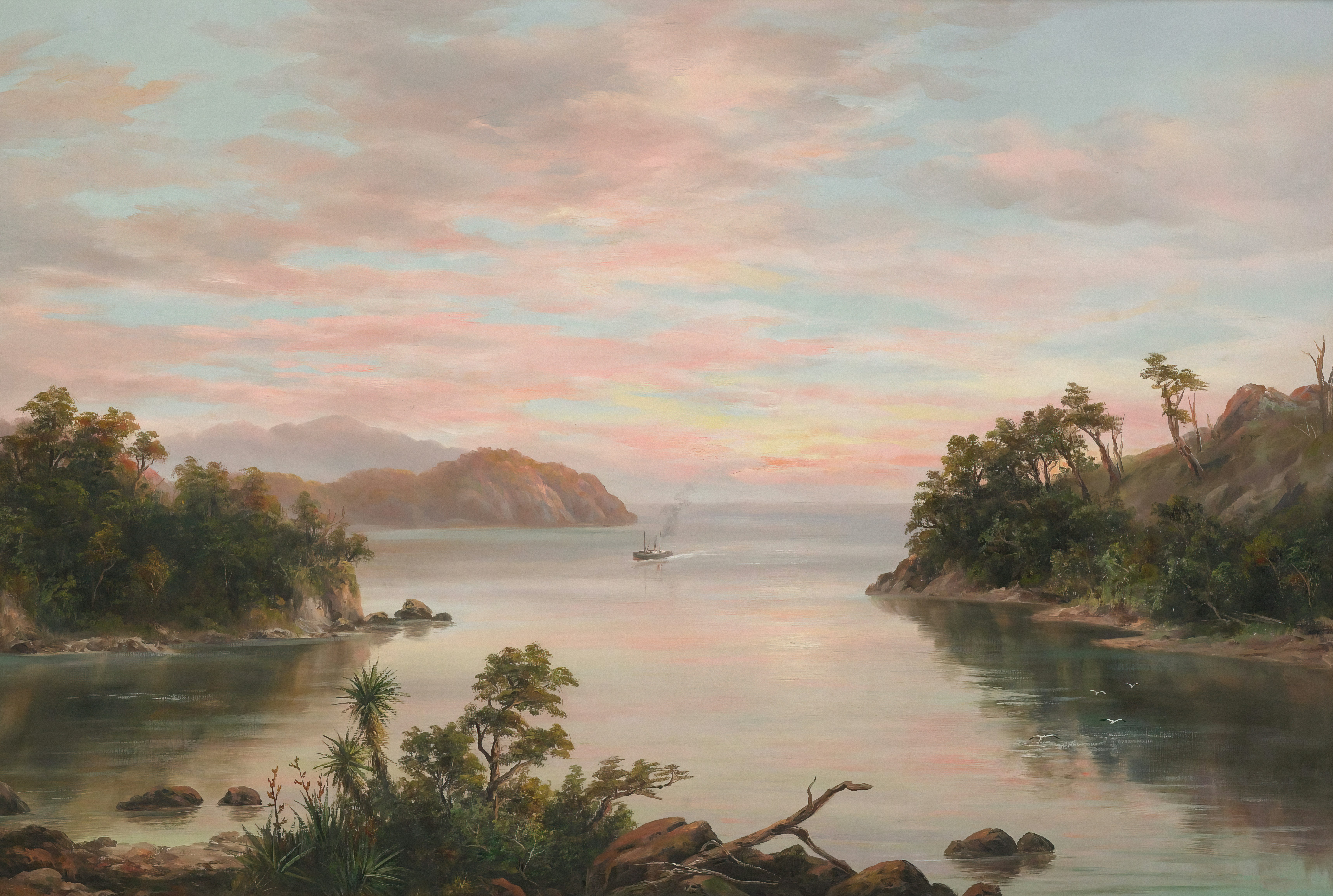 Sailboat on calm water at sunrise with coastal hills.