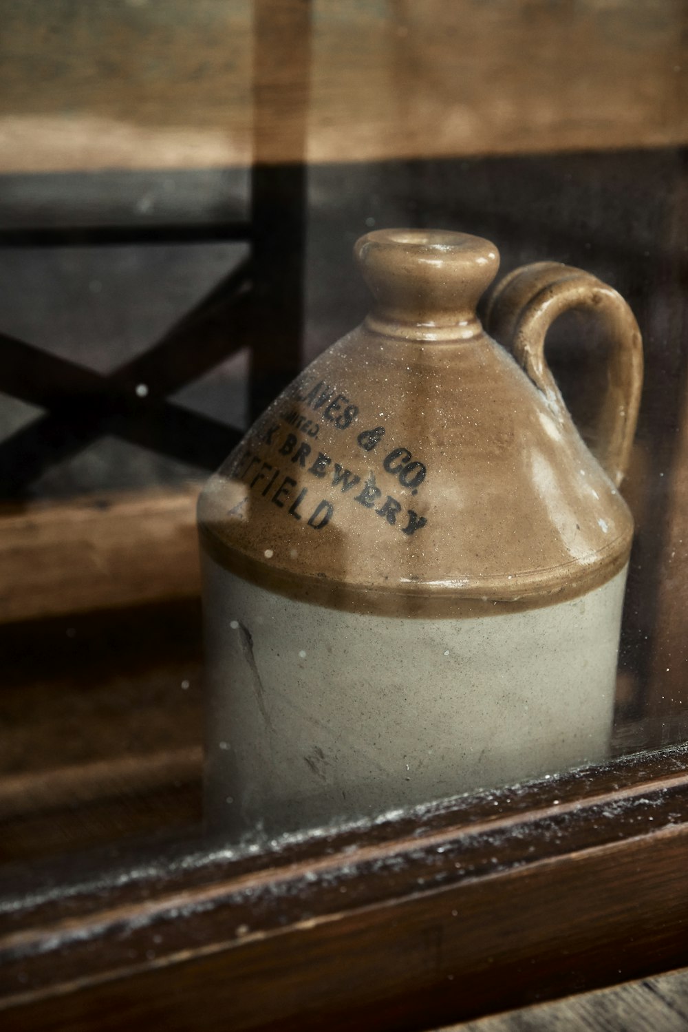 a ceramic jug sitting on a window sill