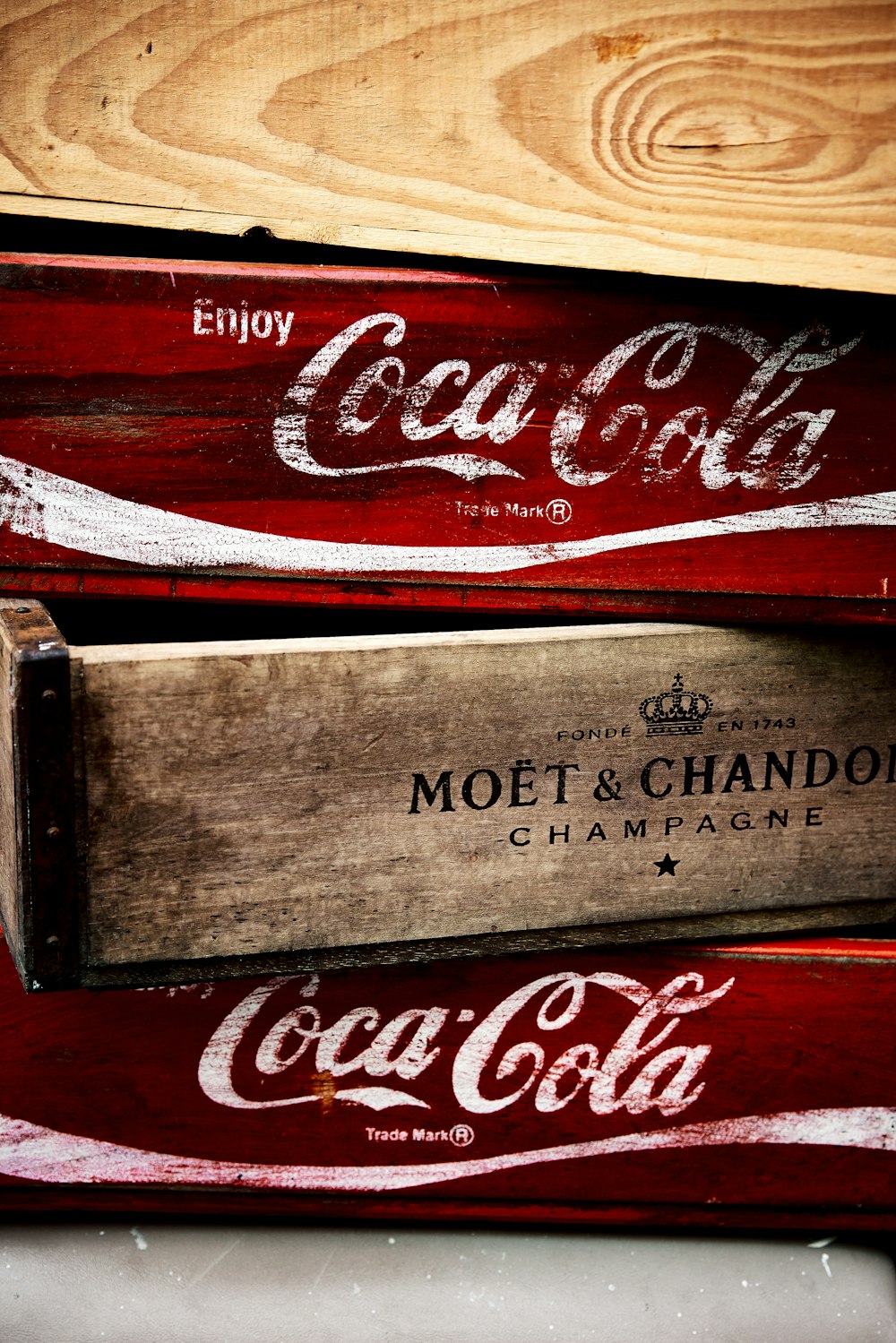 a stack of coca - cola crates sitting on top of a table