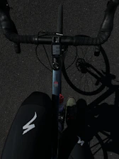 a close up of a bike with a person standing next to it