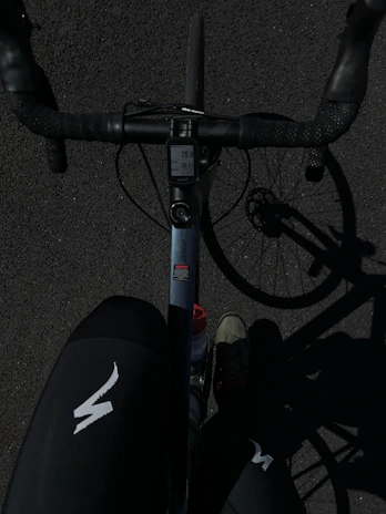 a close up of a bike with a person standing next to it
