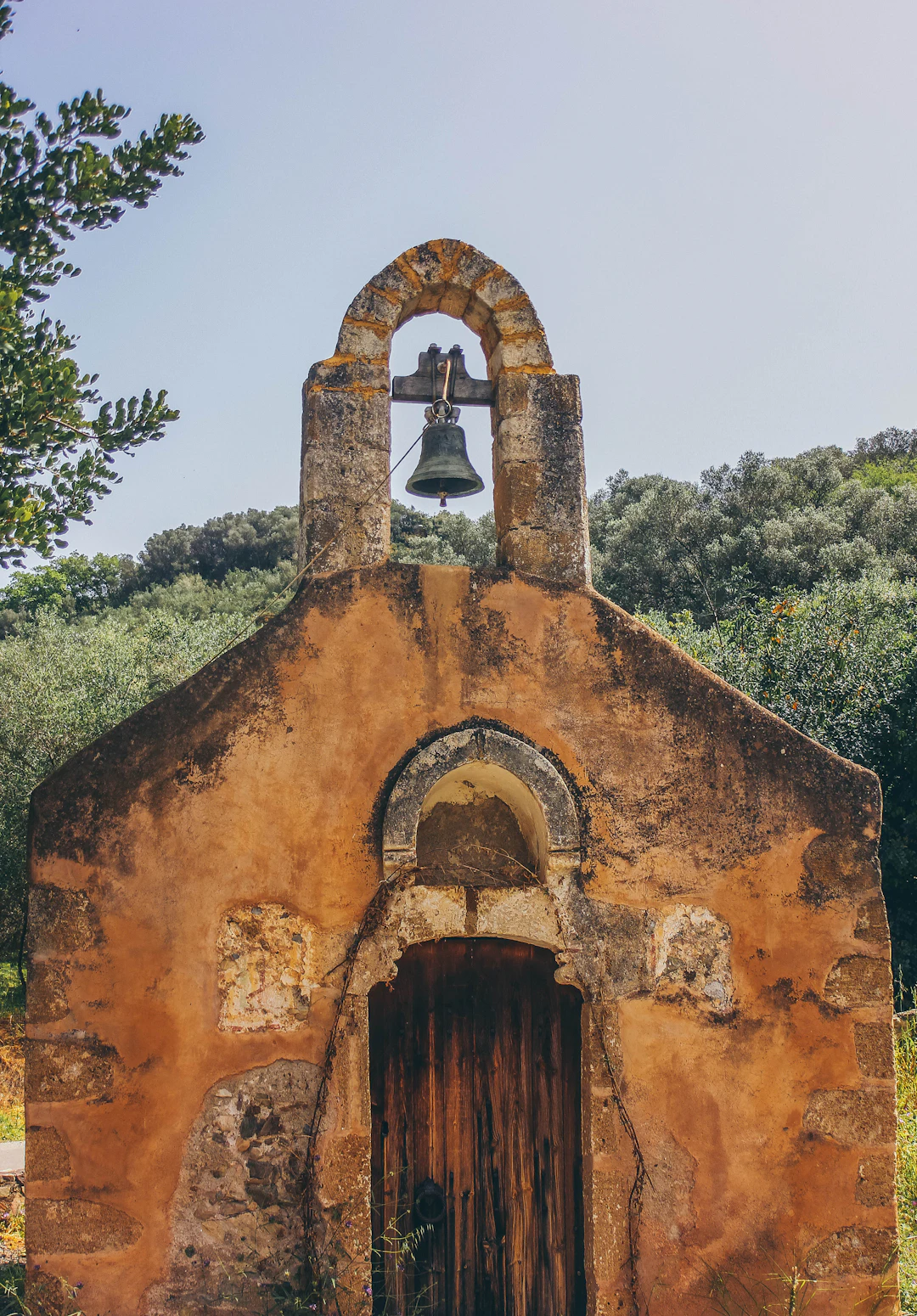 An old stone chapel with a bell (illustration)