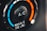 A close-up view of a car's air conditioning control knob, displaying temperature settings. The dial has blue and red colors indicating cooler and warmer temperatures, with the letters 'A/C' in the center. The text 'MAX A/C USE' appears below the dial.